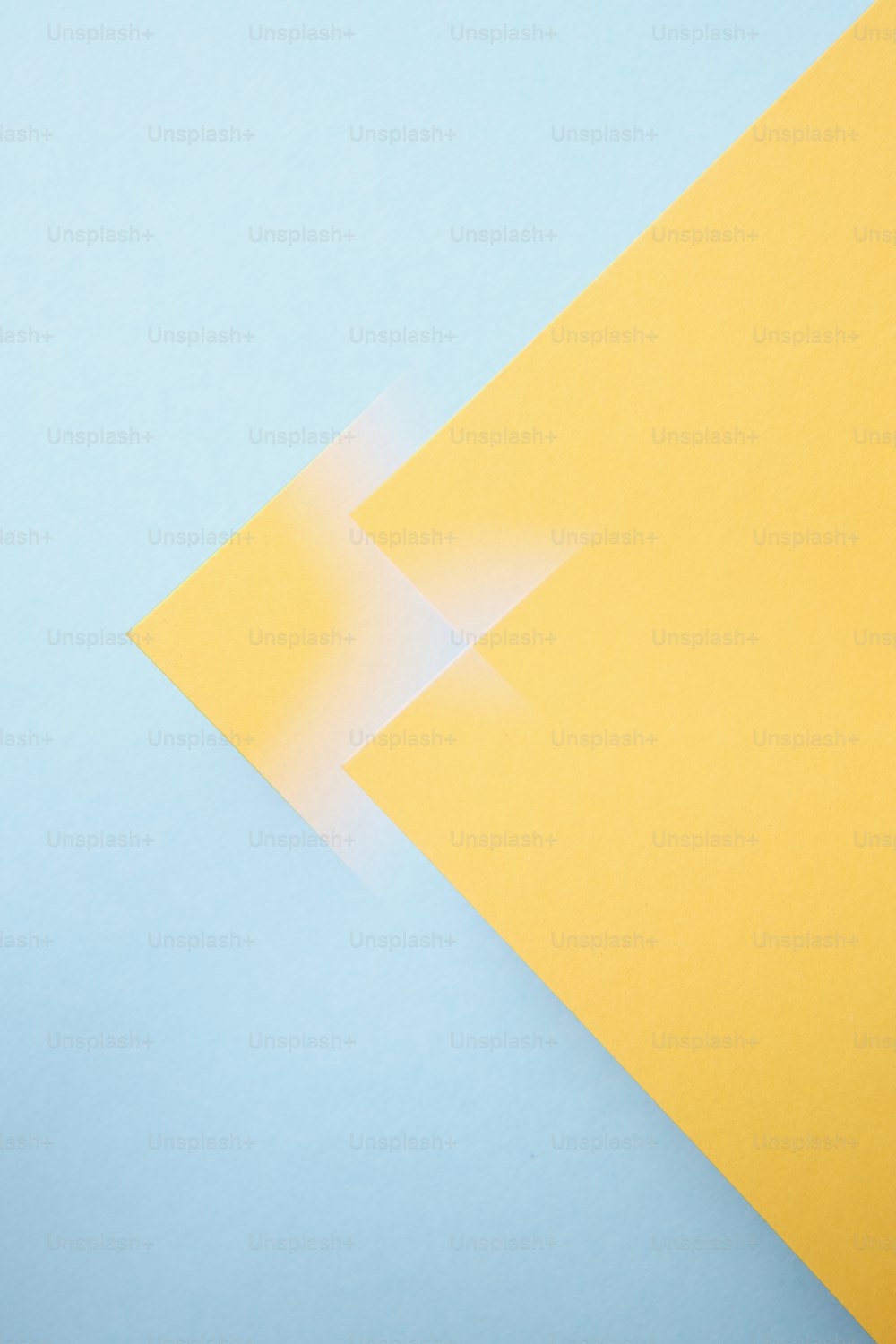 a yellow piece of paper with a white rectangle on it