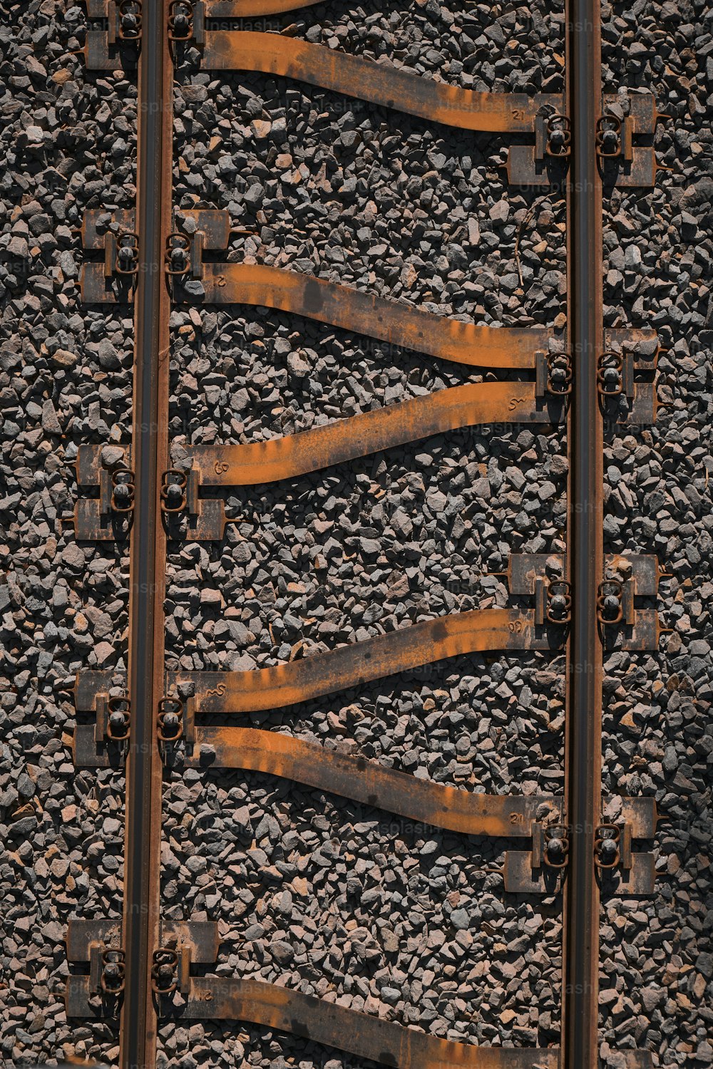 a close up of a train track with rust on it