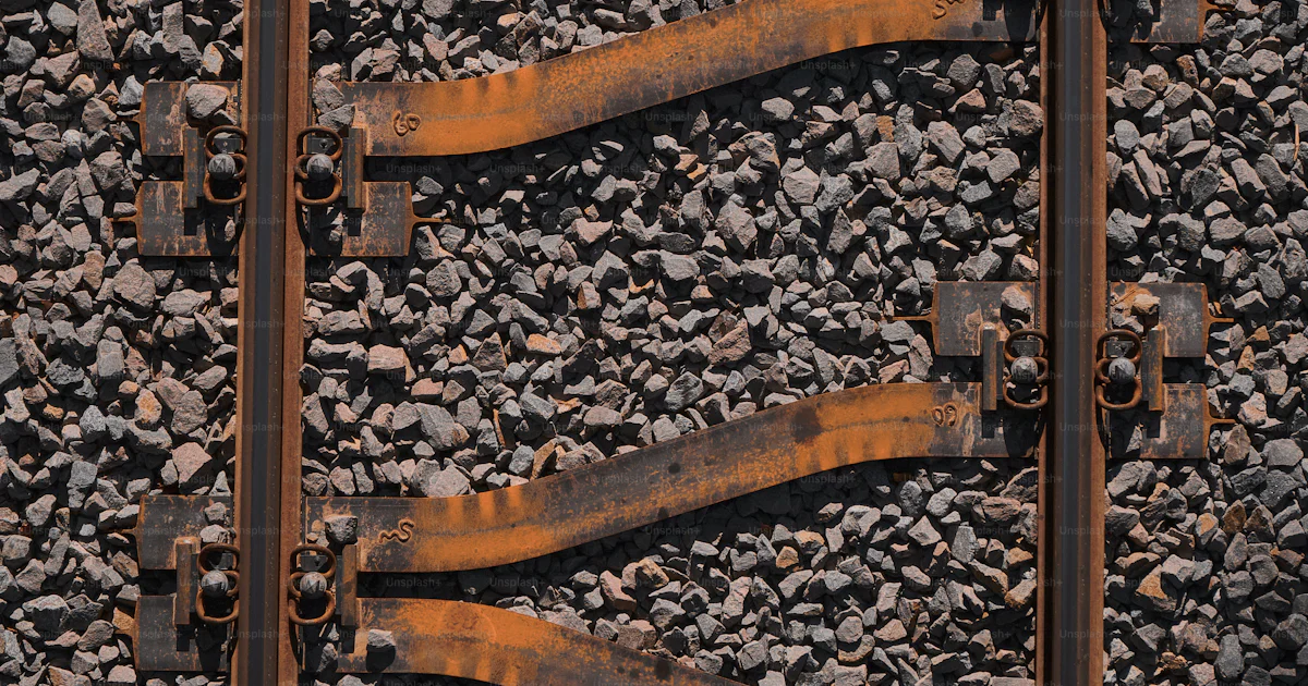 Rail Rust A close up of a train track with rust on it photo – Rails Image on Unsplash