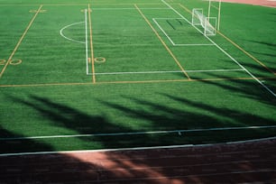 a soccer field with a soccer goal and a soccer goal