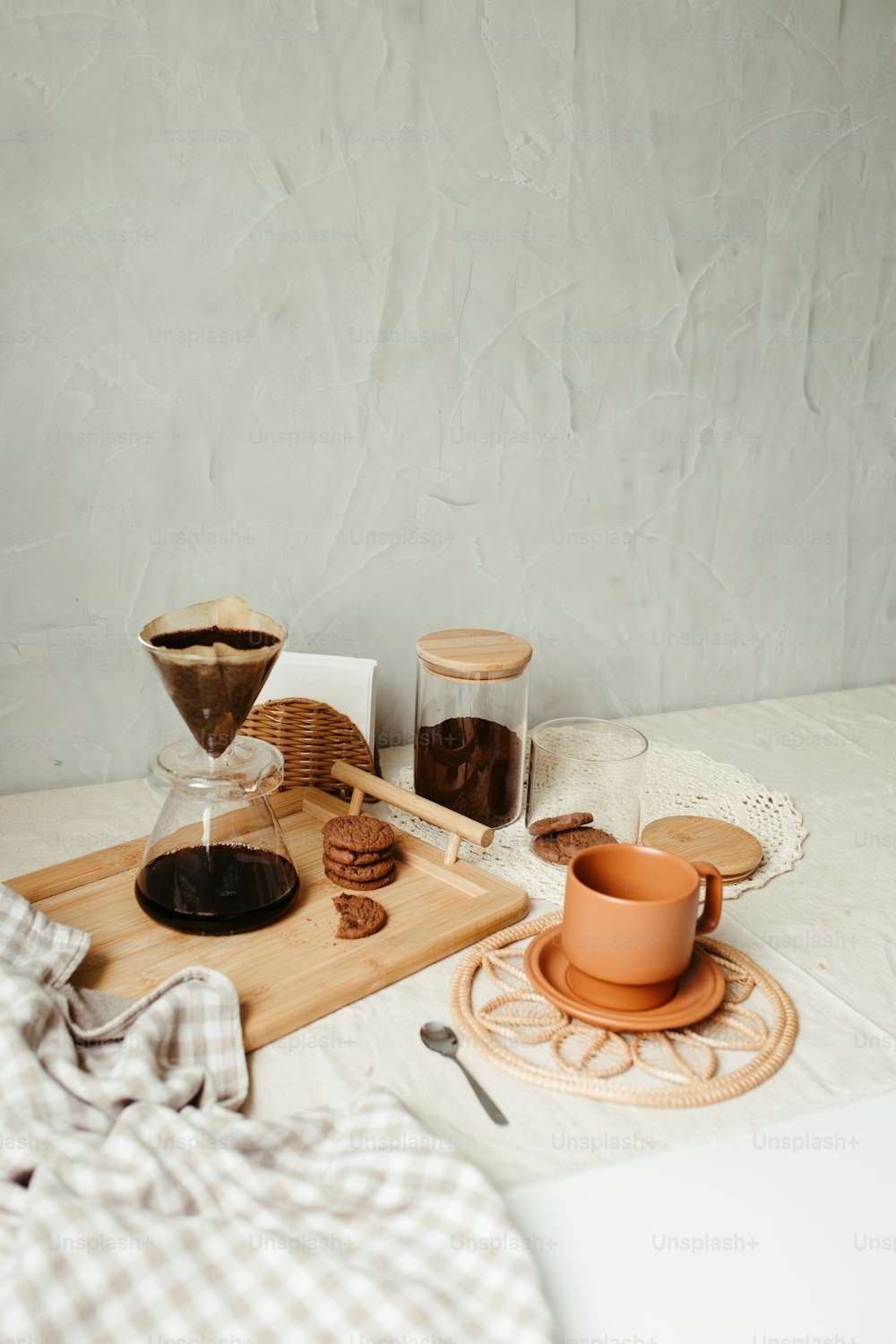 a table topped with two cups of coffee