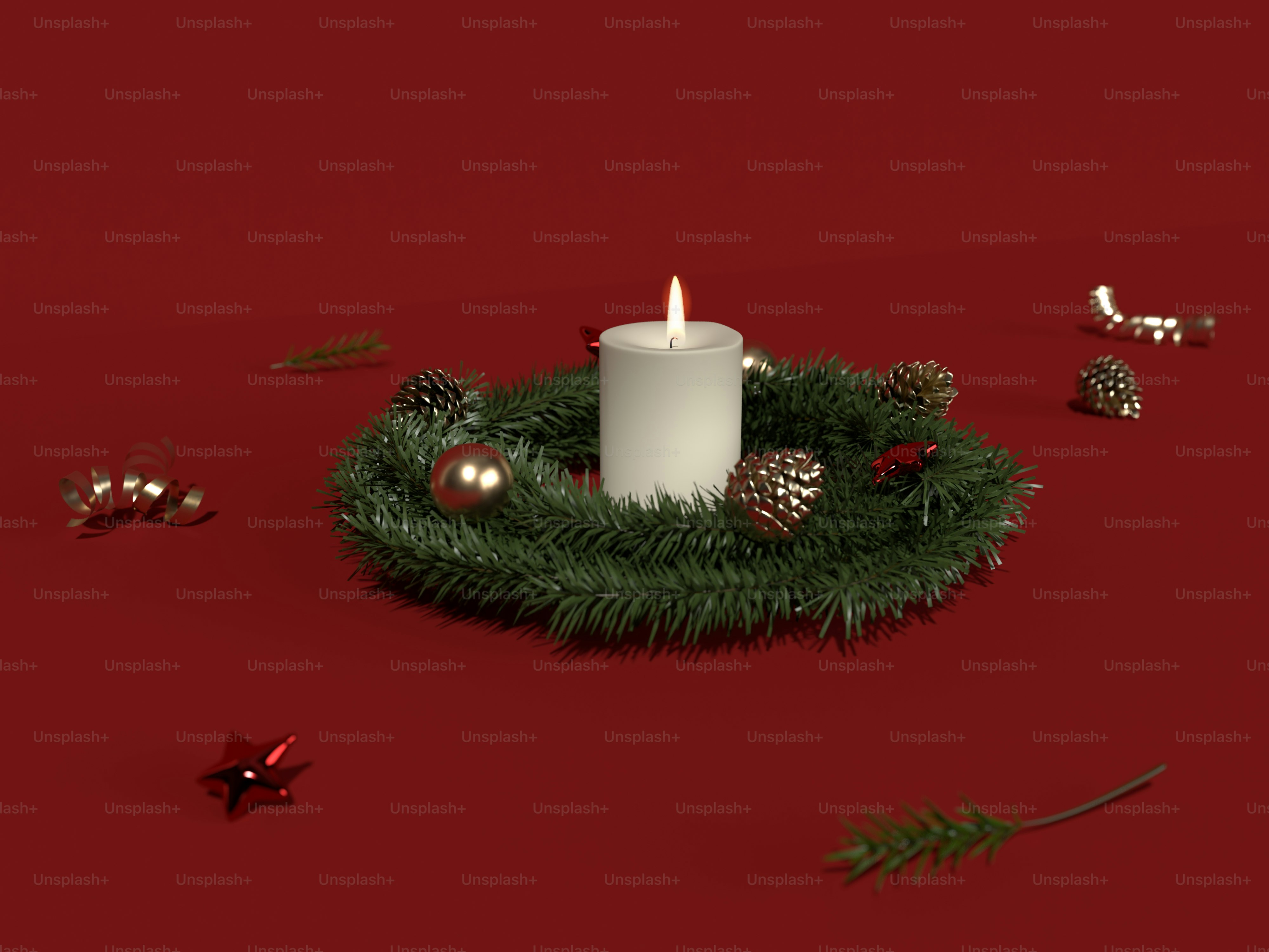 a white candle sitting on top of a green wreath