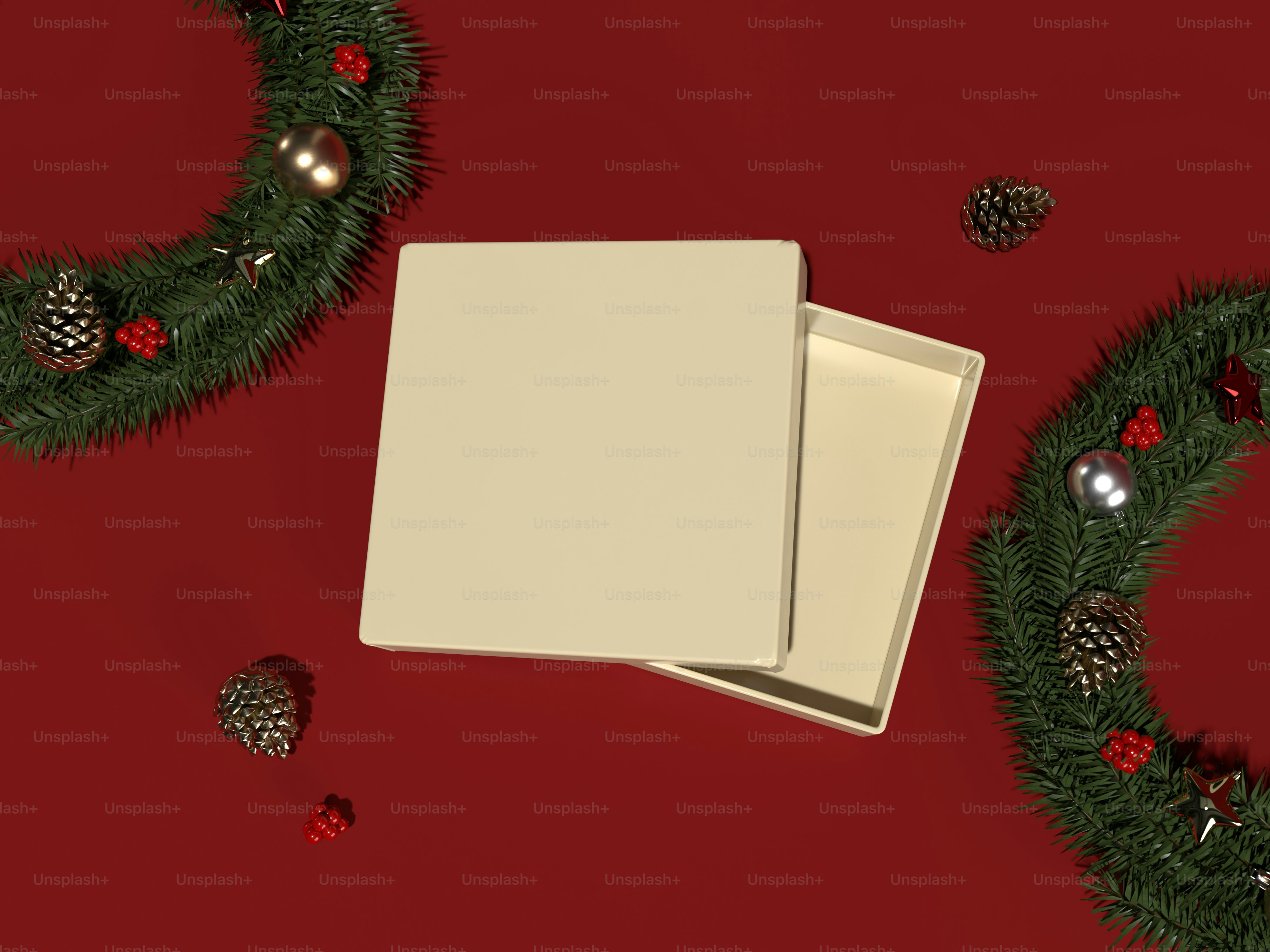 a pair of white boxes sitting next to a christmas wreath