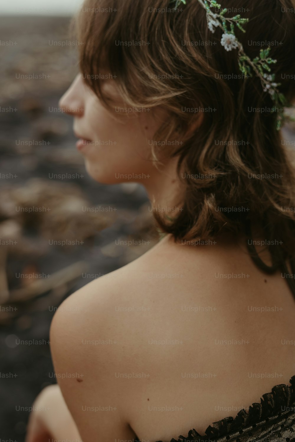 a woman with a flower in her hair