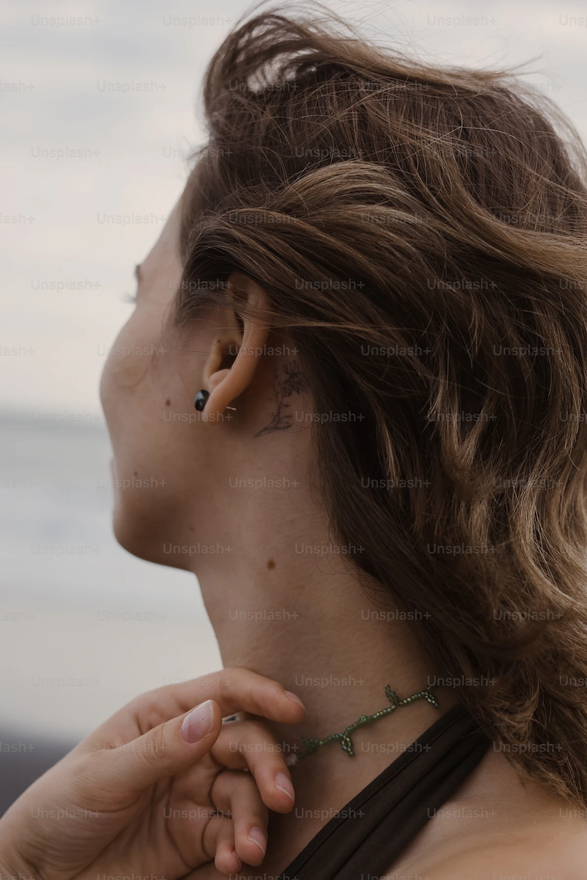 Woman's ear with a cartilage piercing