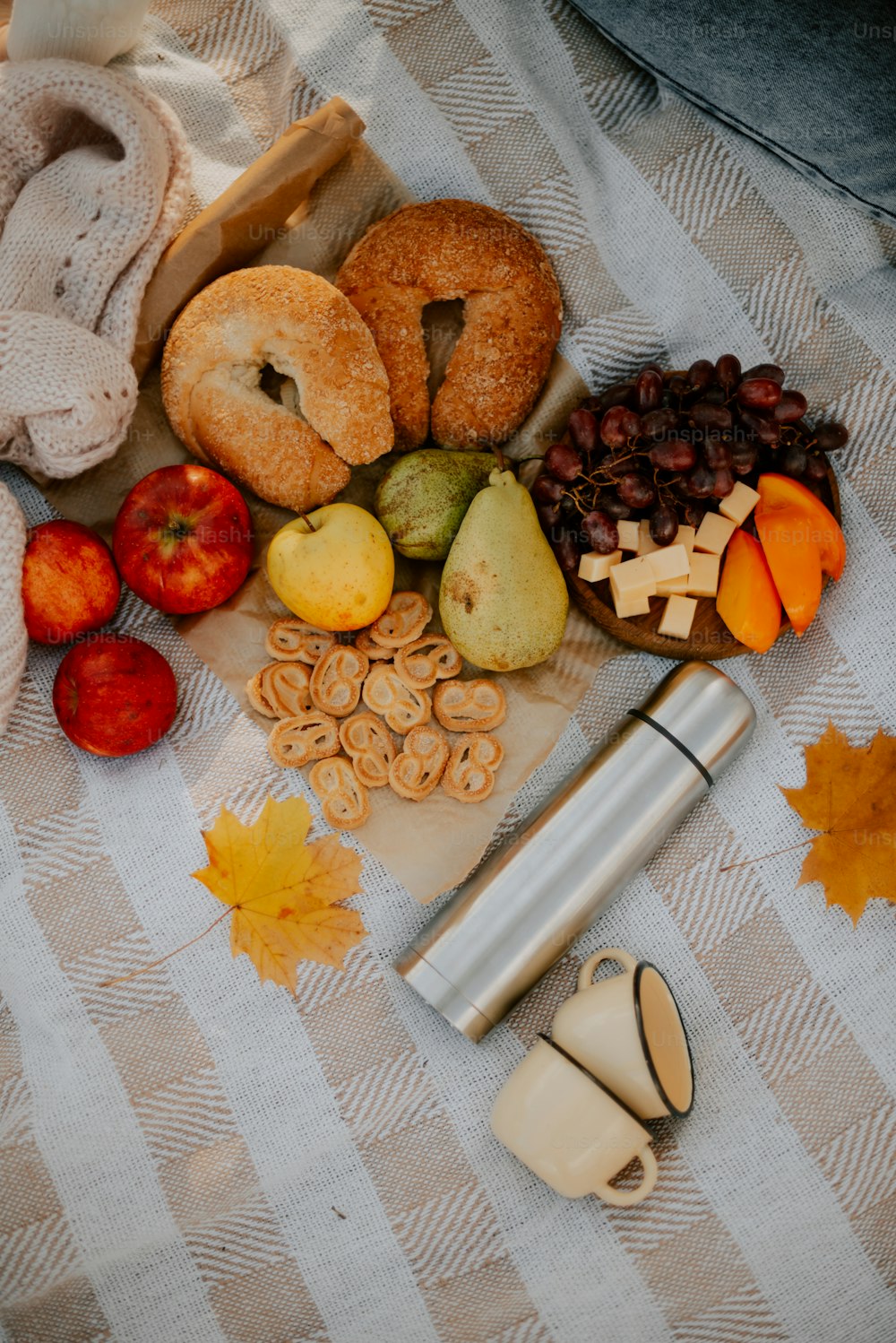 a table topped with donuts, apples, raisins and other foods