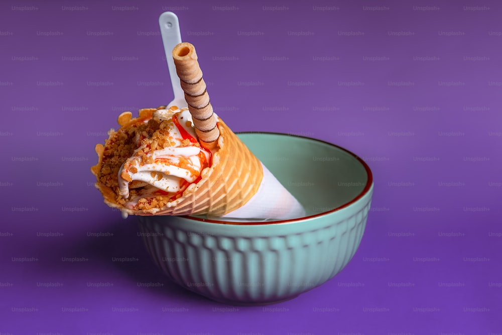 an ice cream sundae in a bowl on a purple background