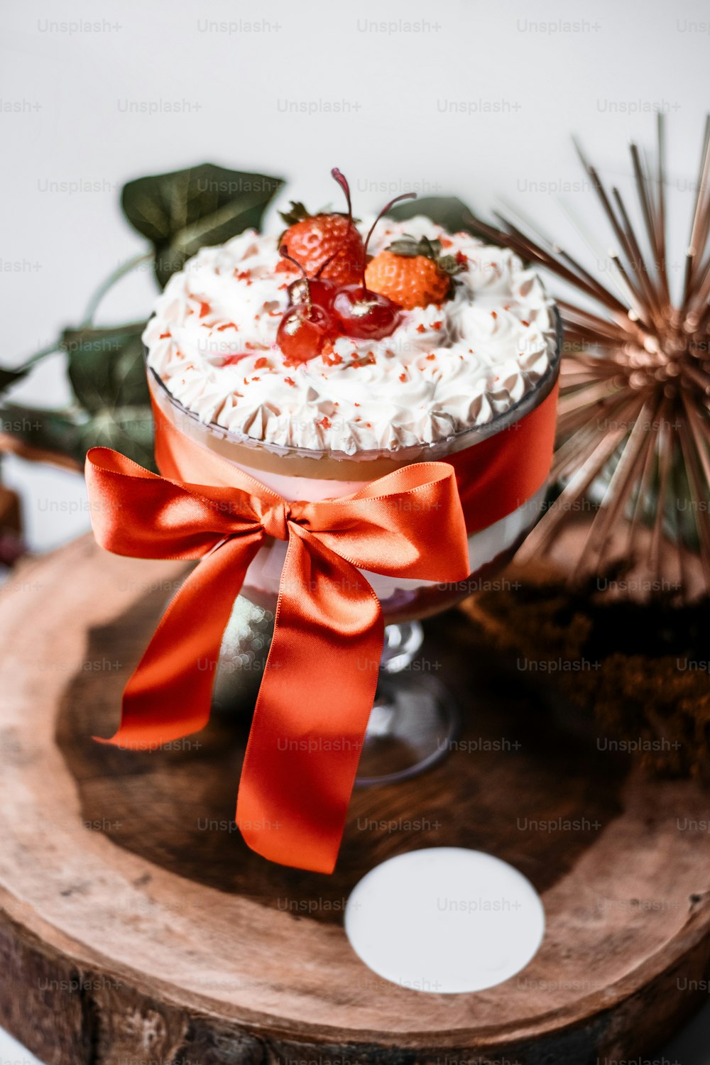 a cake with strawberries and whipped cream on top