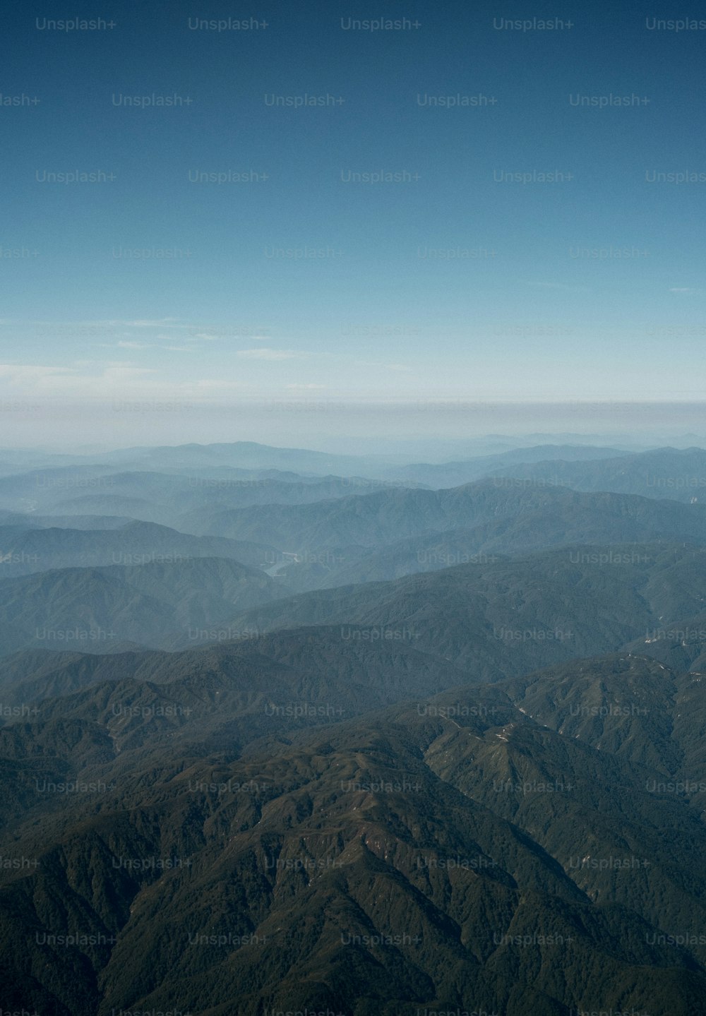 a view of a mountain range from an airplane