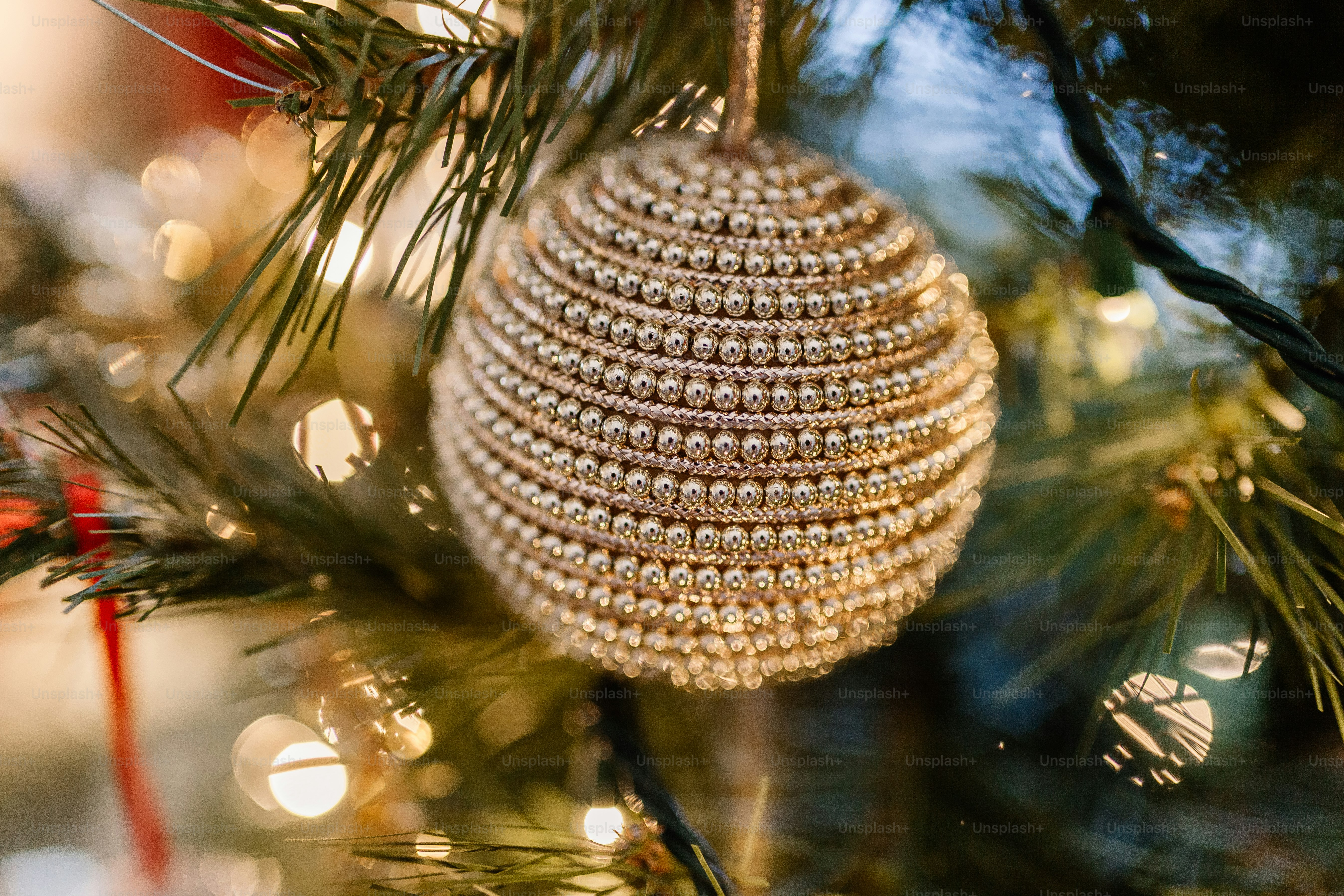 A close up of a christmas ornament on a tree photo – Decorations Image ...