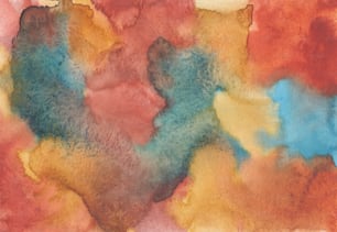 a watercolor painting of different shades of blue, orange, and yellow