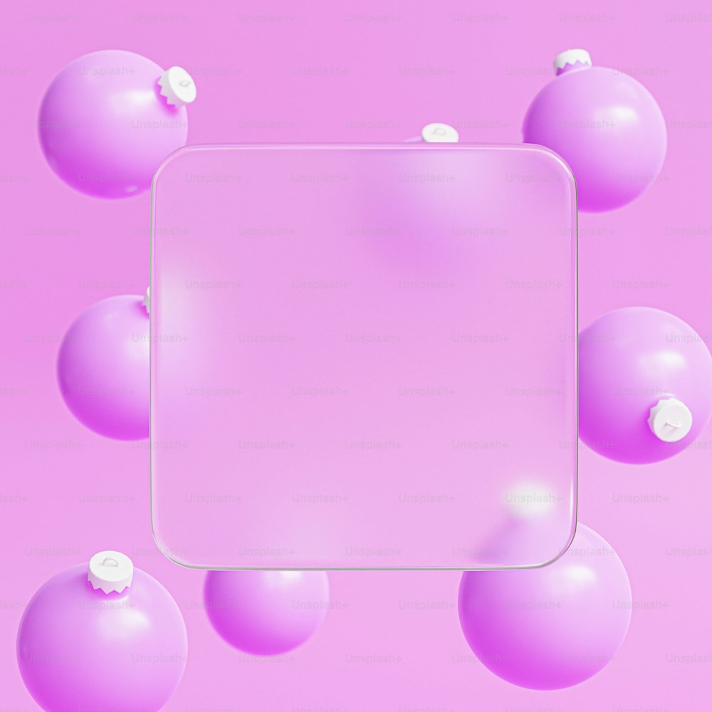 ein weißer quadratischer Rahmen, umgeben von rosa Kugeln
