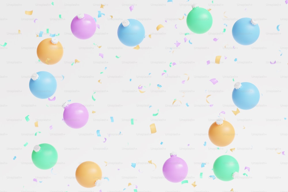 a group of balloons and confetti on a white background