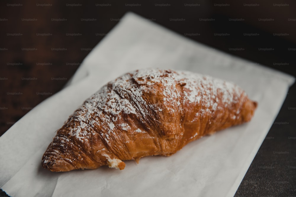 a pastry on a napkin on a table