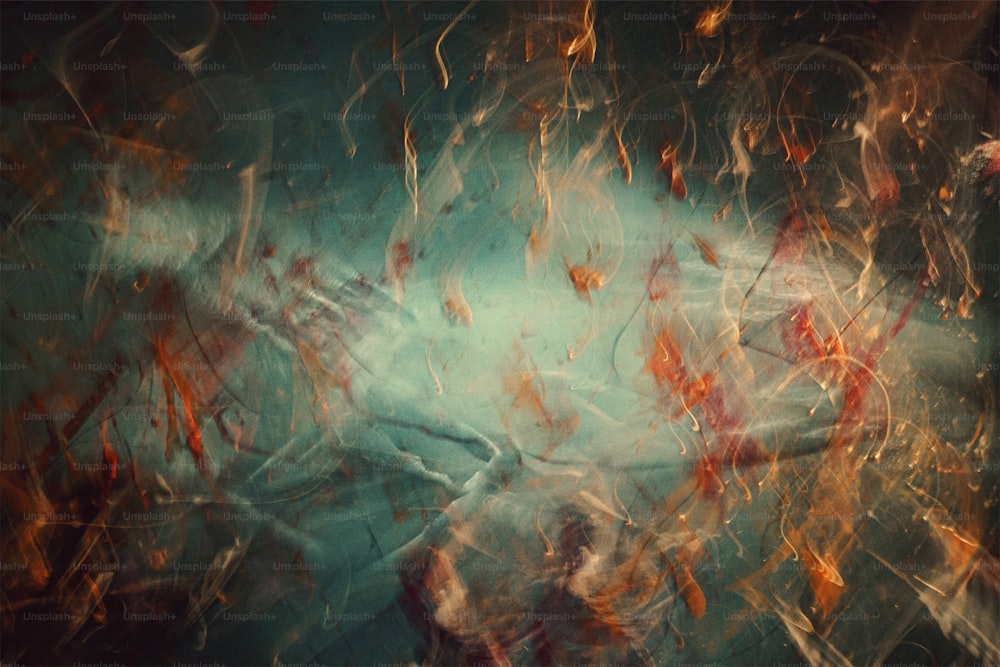 an abstract painting of red, orange, and blue colors