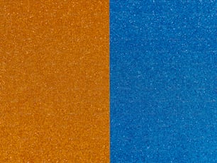 a close up of a blue and orange background