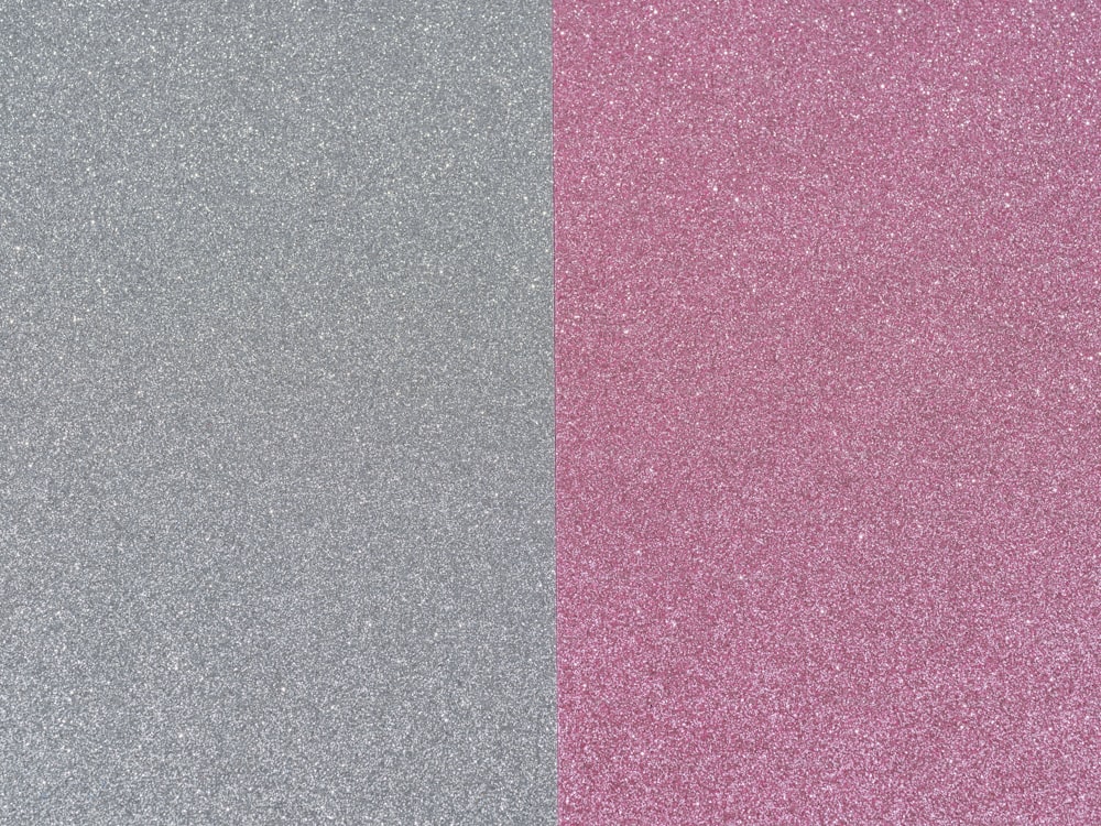 a pair of gray and pink glittered paper