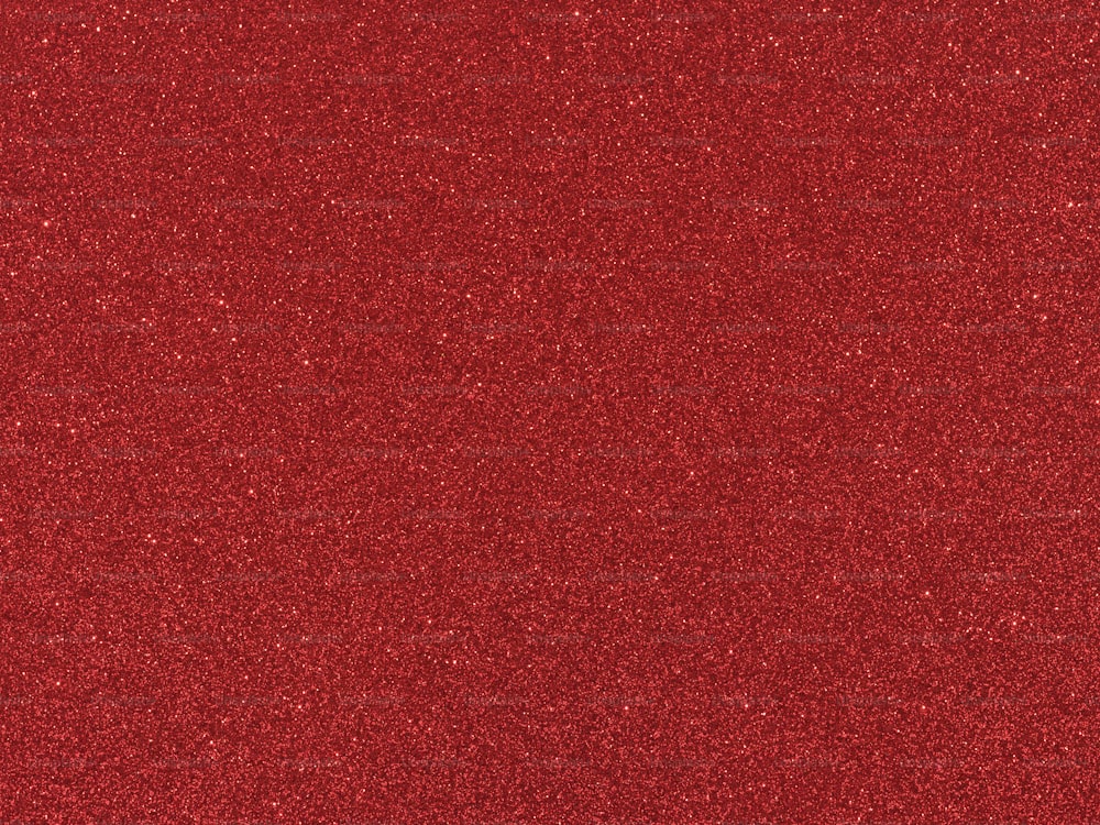 a close up of a red glitter textured surface
