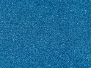 a blue background with a small amount of glitter