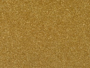 a close up of a gold glitter background