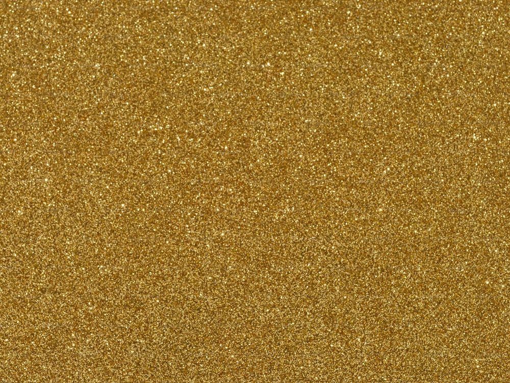 Un primer plano de un fondo de brillo dorado
