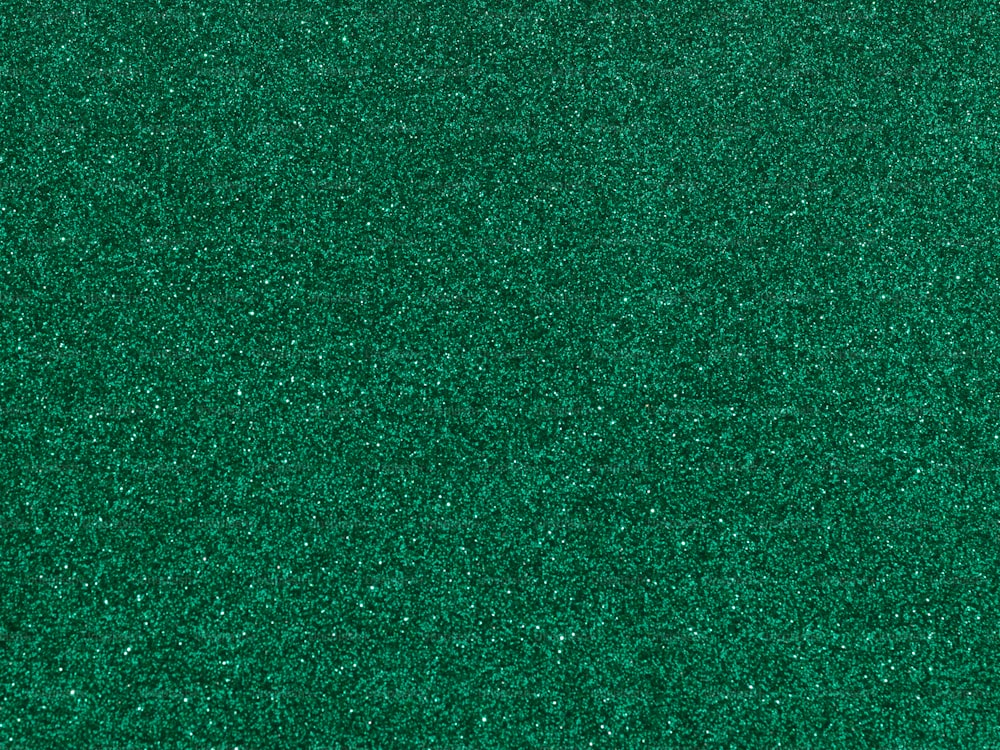 a close up view of a green surface