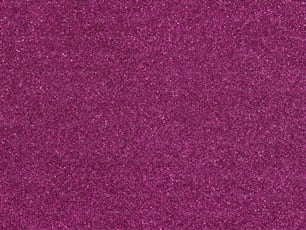a close up of a purple glitter background
