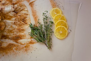 a close up of a plate of food with lemons