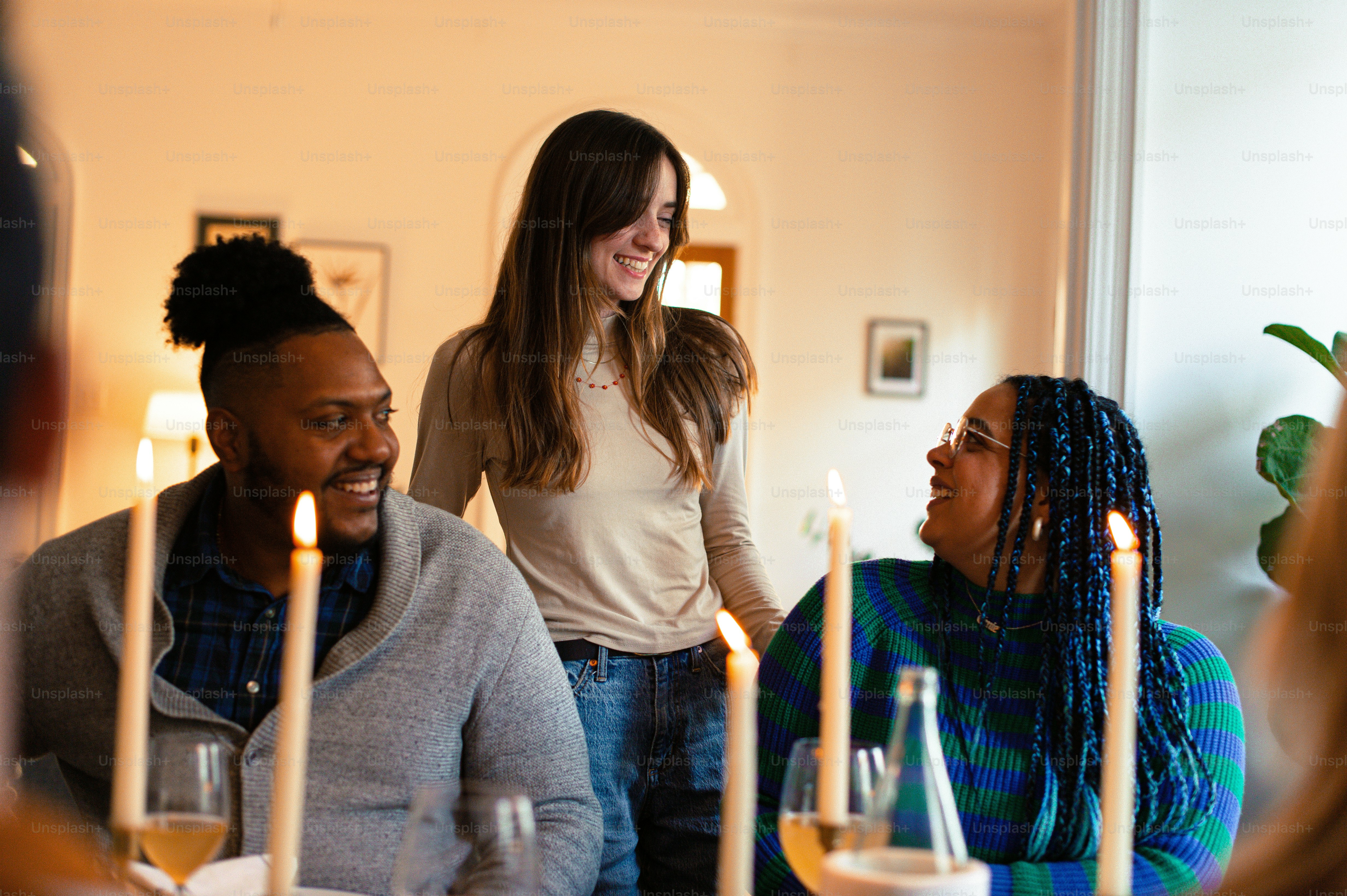 a group of people sitting around a dinner table