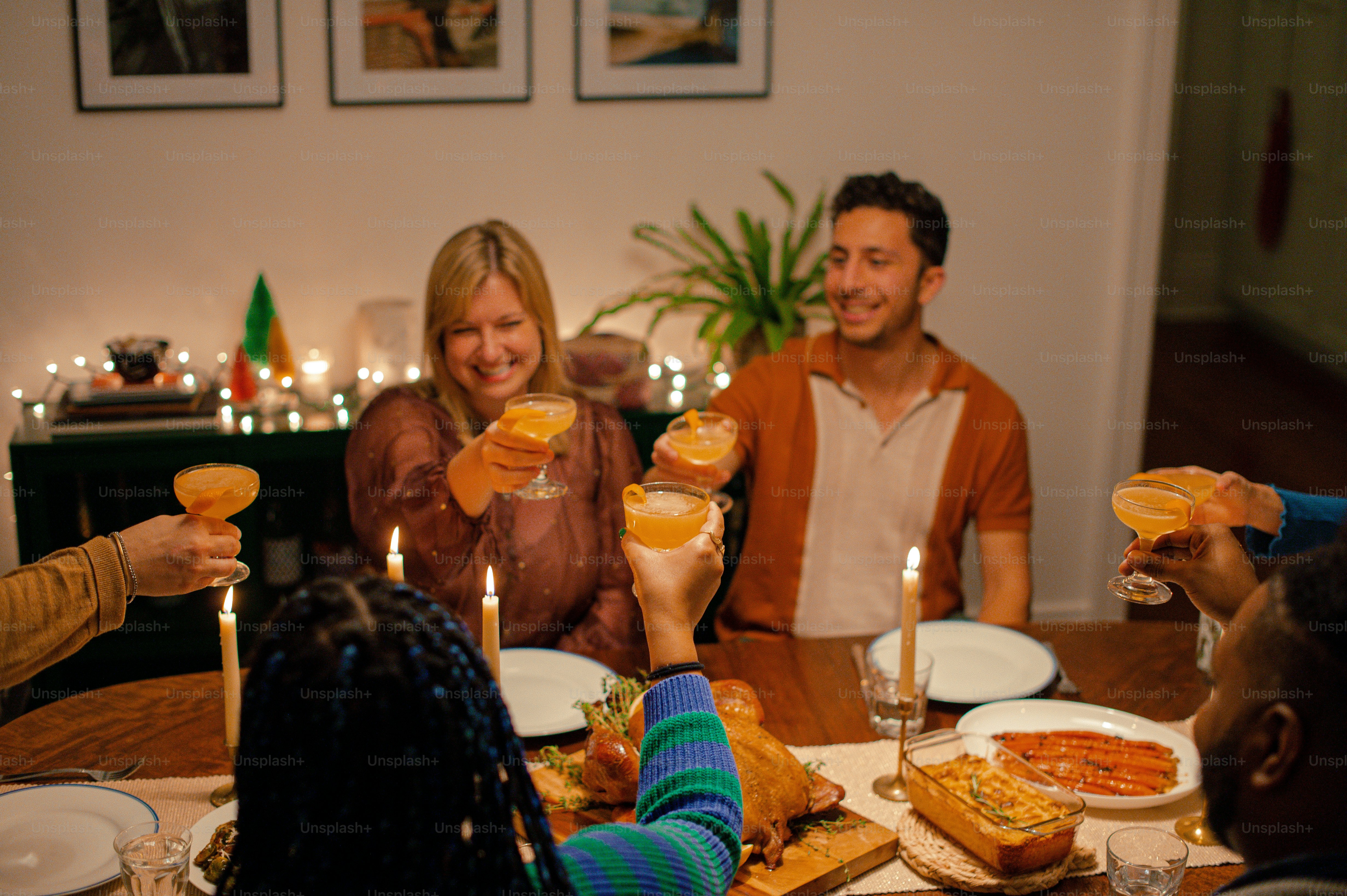 a group of people sitting around a table with drinks