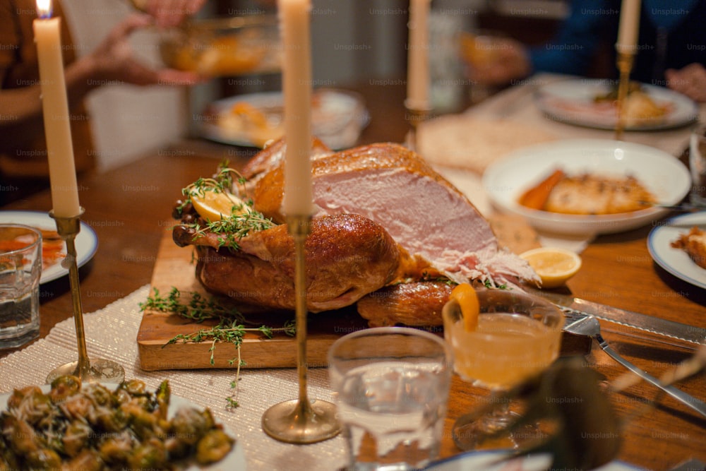 a large turkey sitting on top of a wooden table