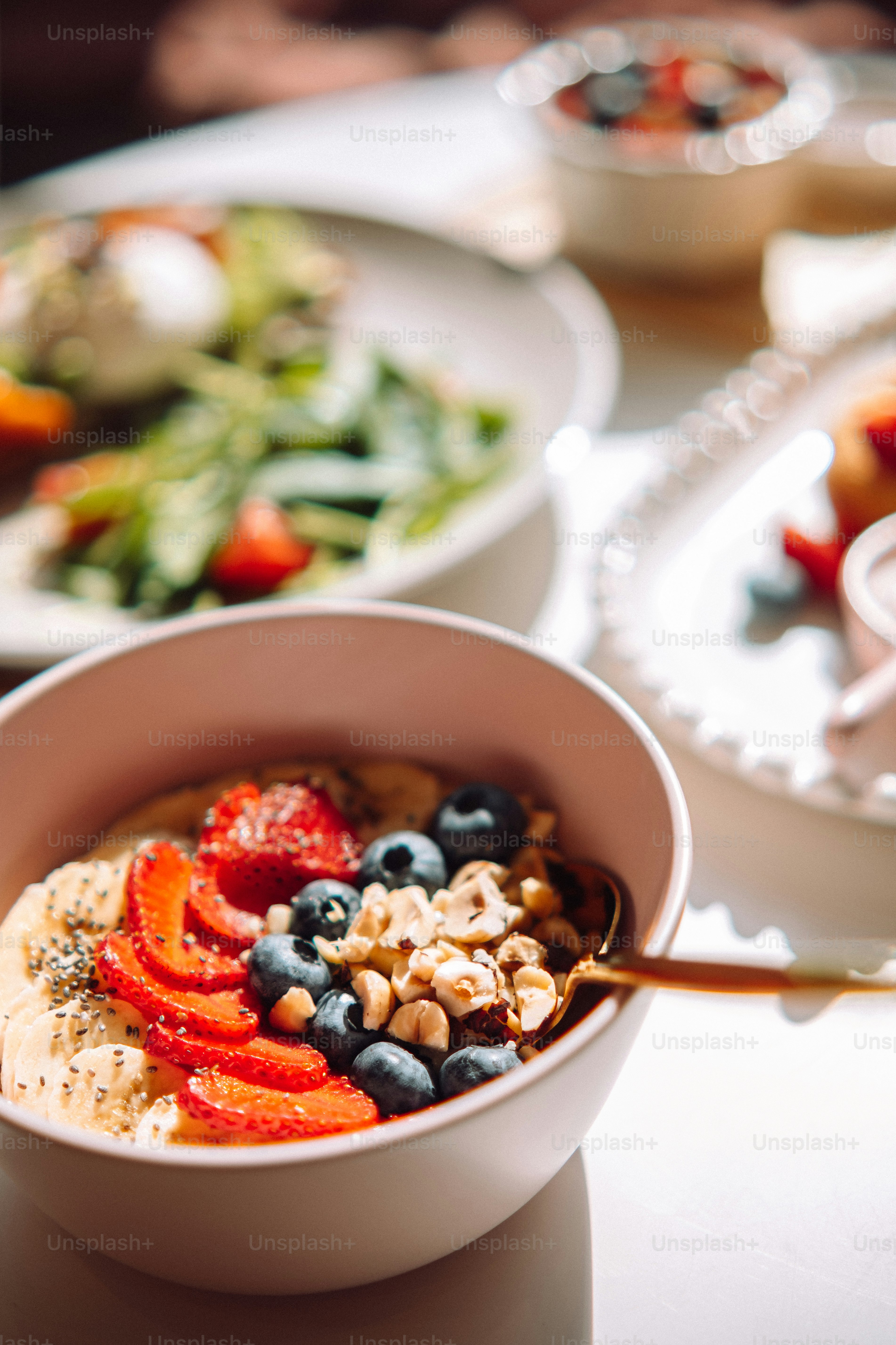 a bowl of oatmeal with fruit and nuts