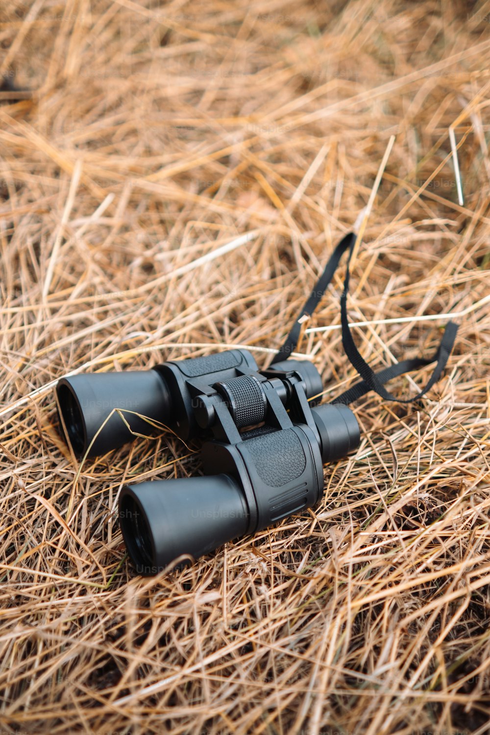 a pair of binoculars laying on the ground