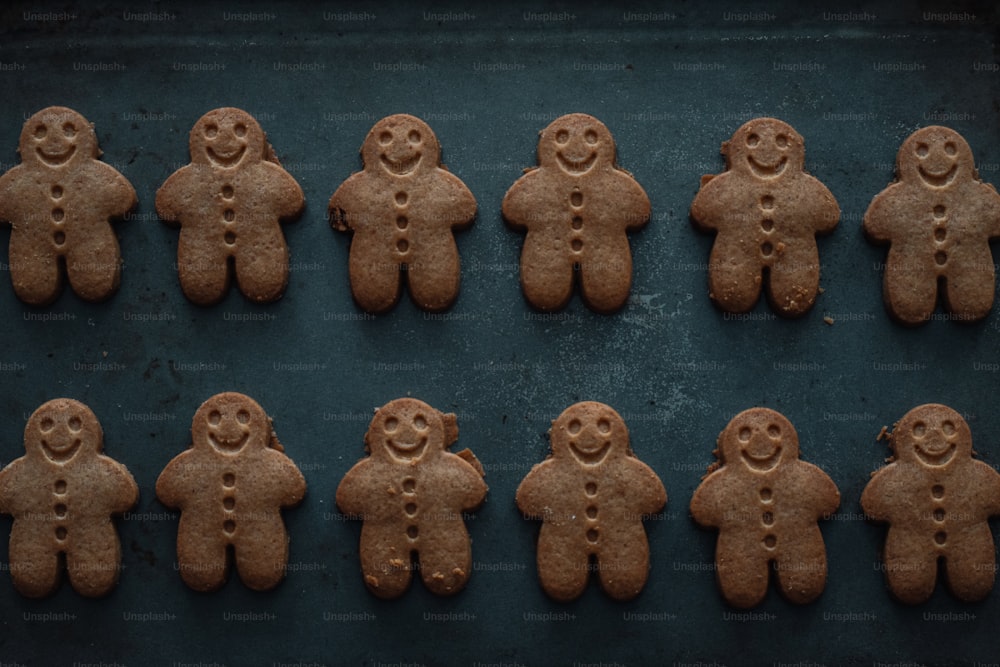a bunch of cookies that are shaped like people