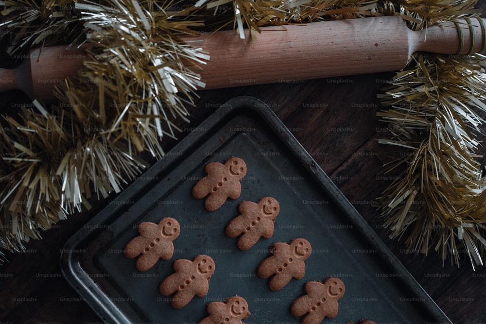 a cookie sheet with cookies shaped like teddy bears on it