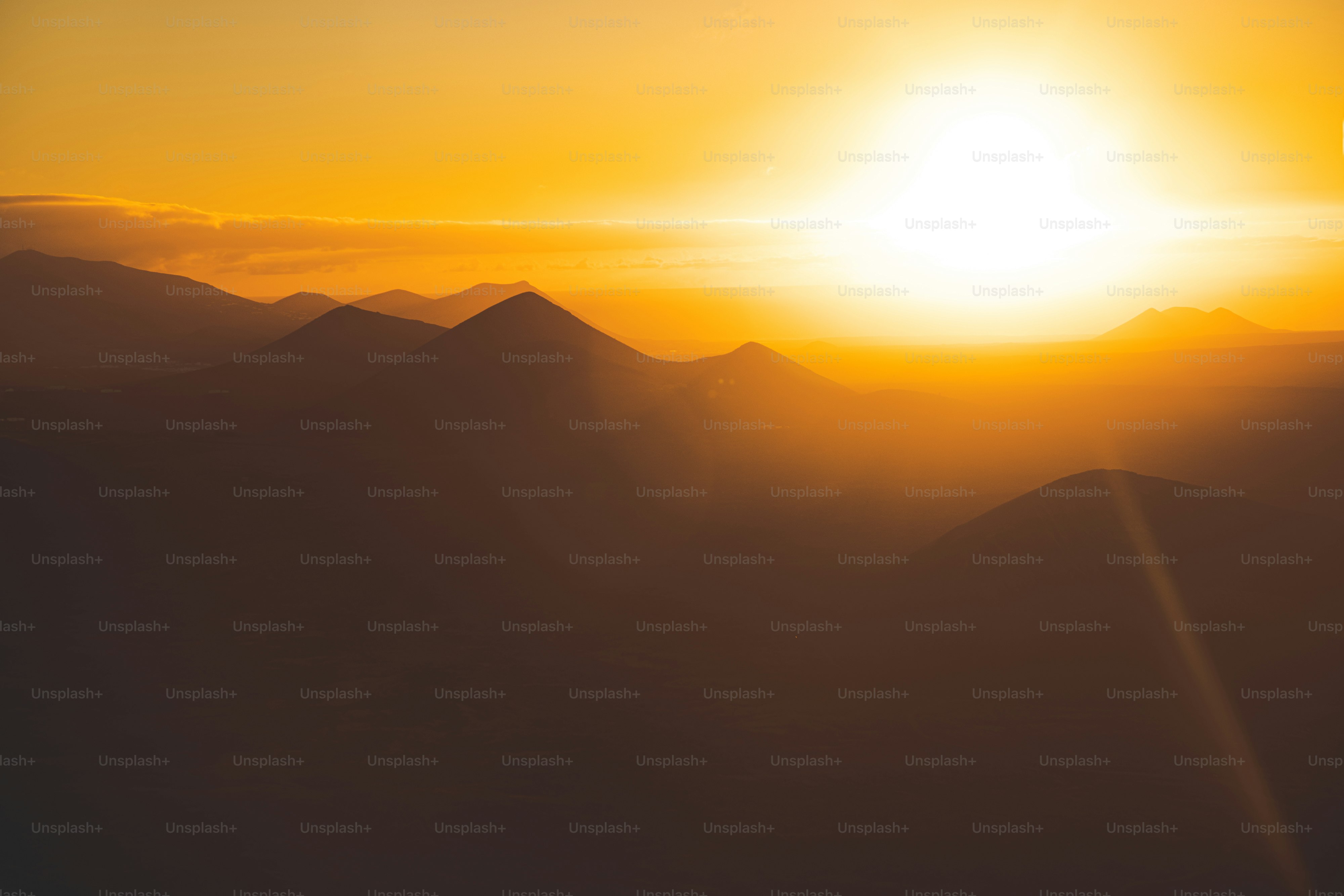 The sun is setting over a mountain range photo – Wallpapera Image on ...