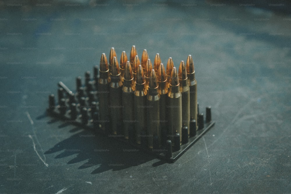 a bunch of bullet shells sitting on top of a table