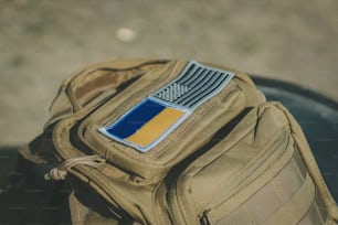 a backpack with a flag patch on it