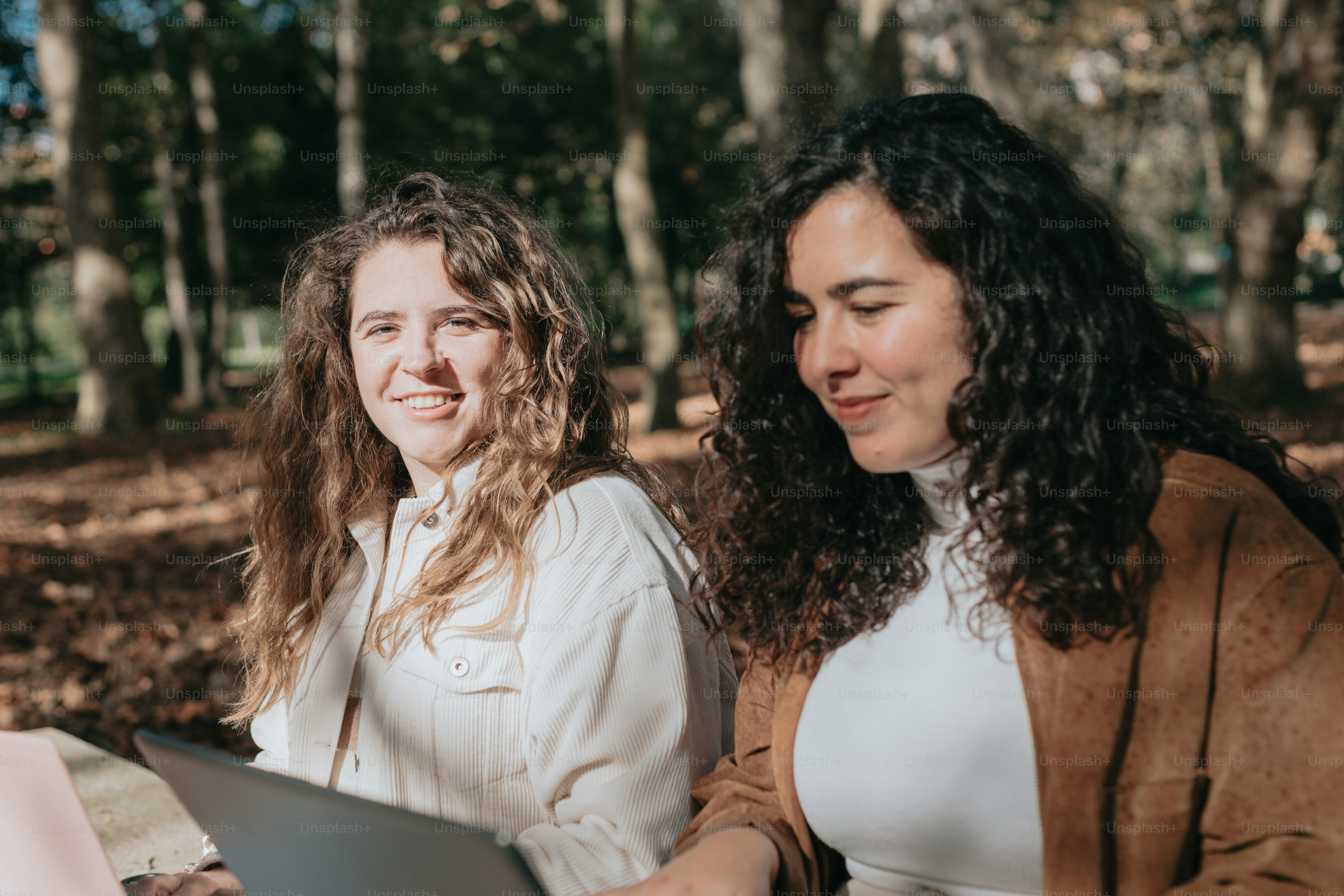 a couple of women sitting next to each other