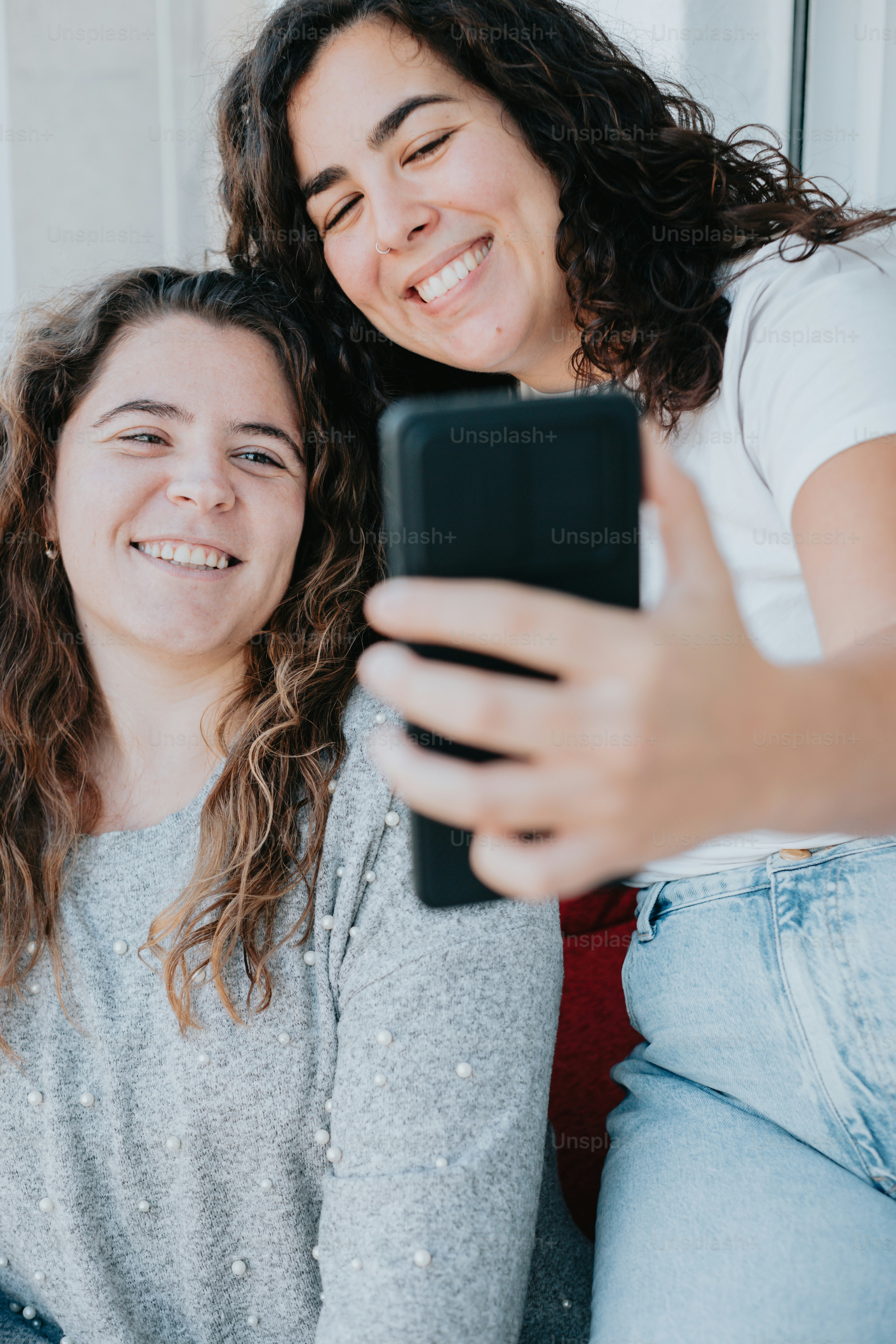 a woman taking a picture with her phone