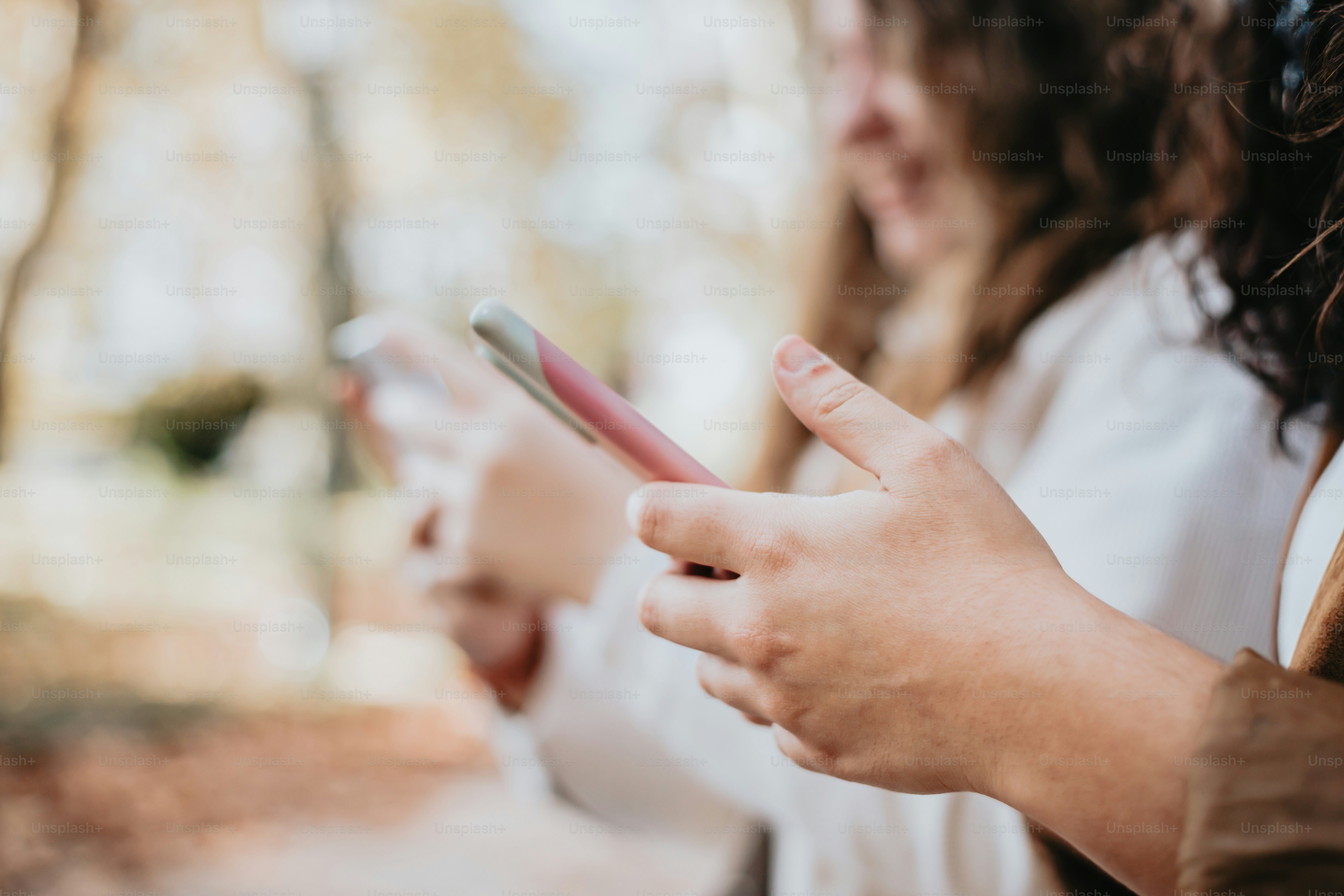 a close up of a person holding a cell phone