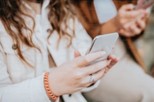 a close up of a person holding a cell phone