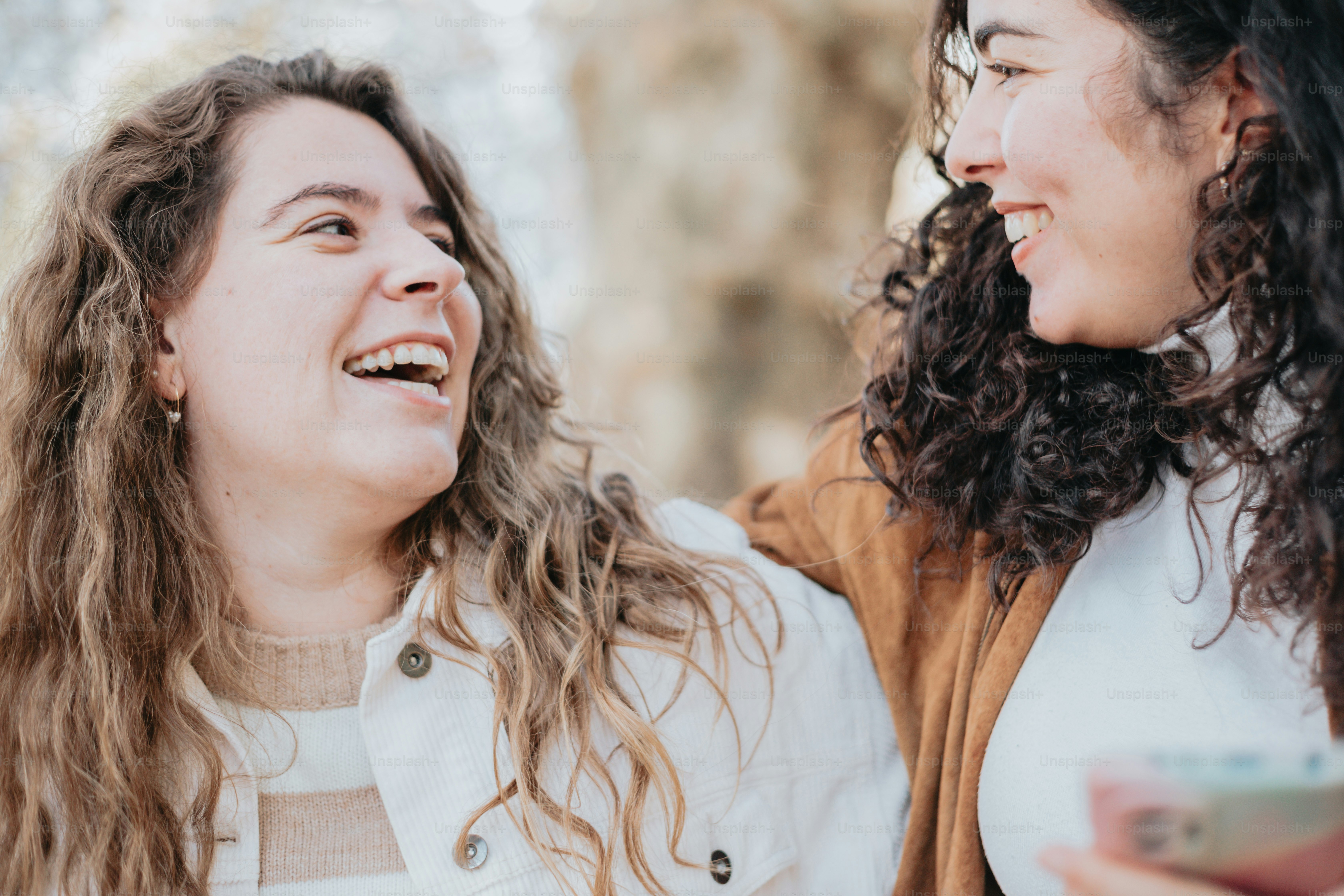 a couple of women standing next to each other