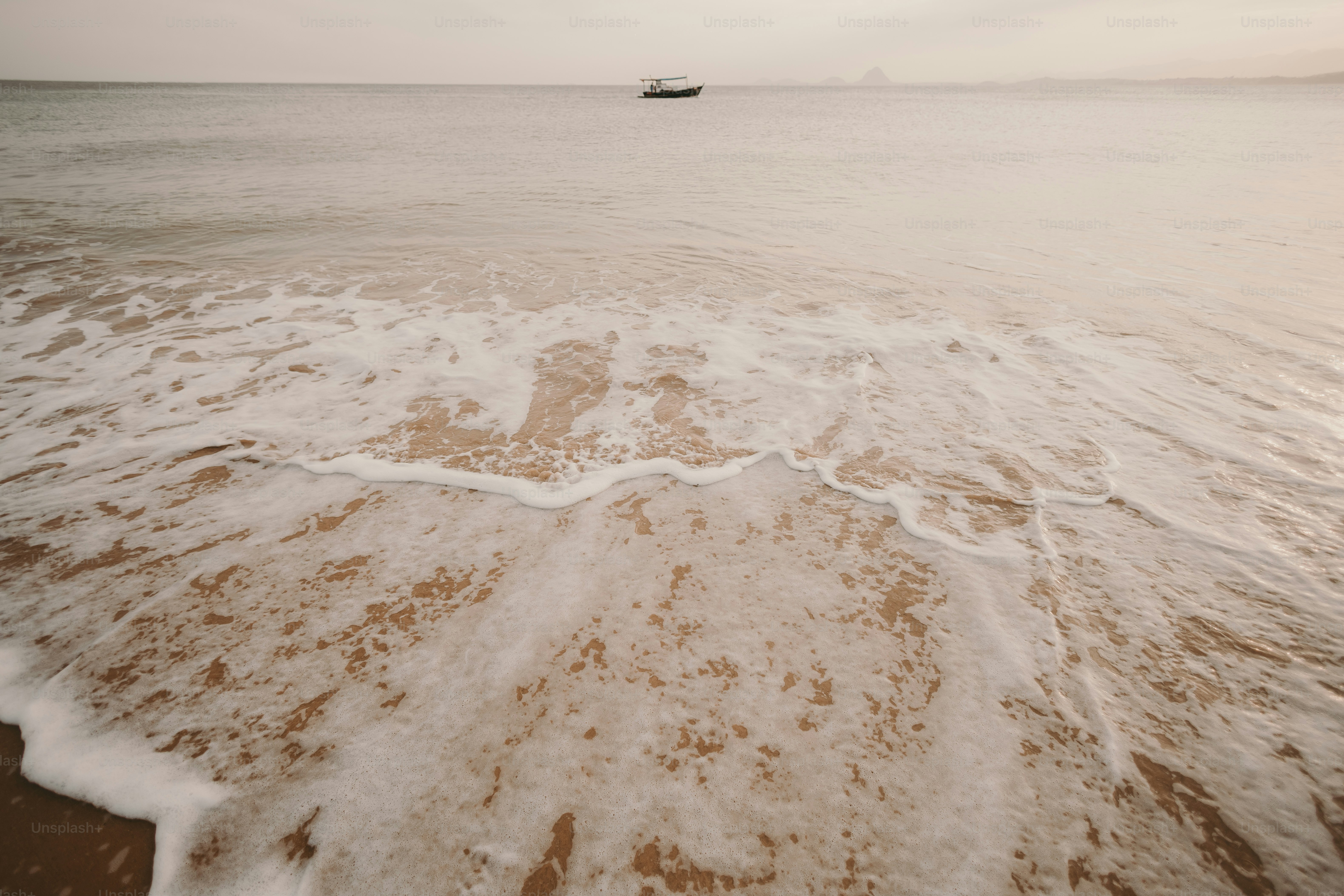 a boat is in the distance on the water
