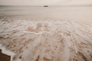 a boat is in the distance on the water