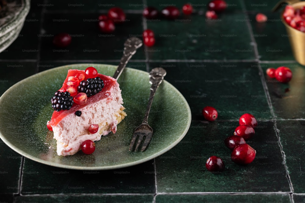 a piece of cake sitting on top of a green plate