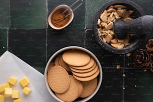 a bowl of crackers next to a bowl of food