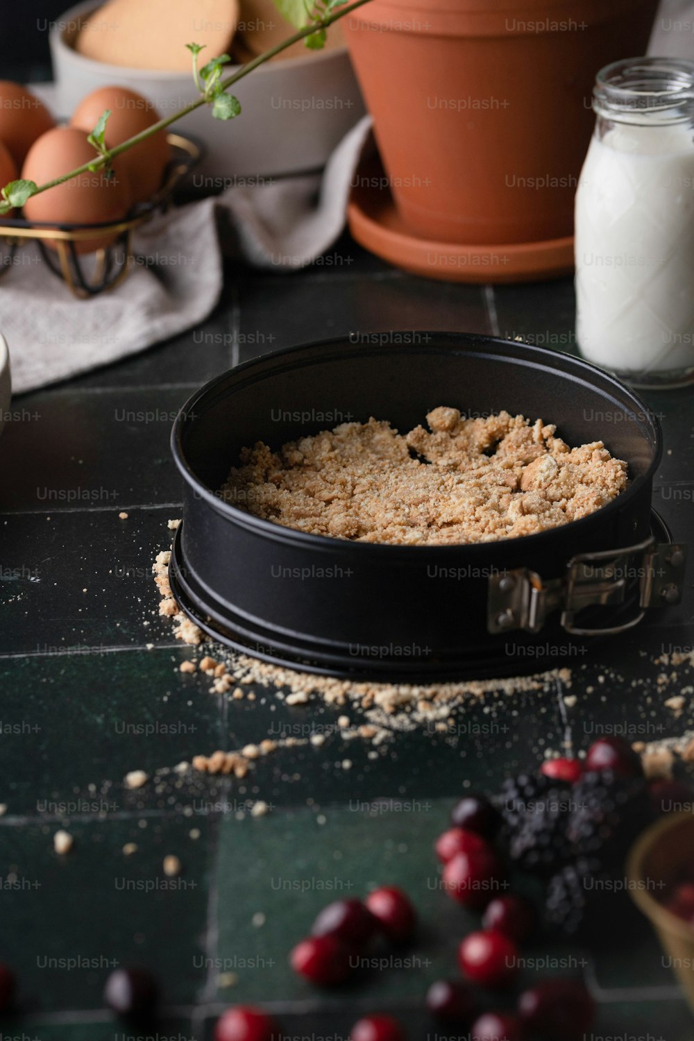 a bowl of cranberry oatmeal sits on a counter next to