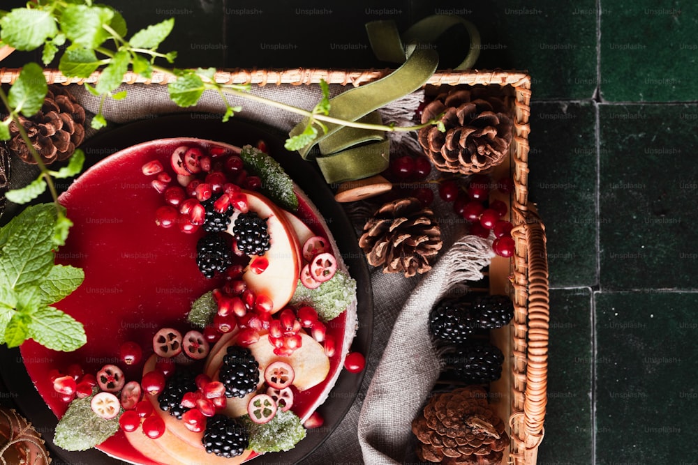 a plate of fruit and berries on a table