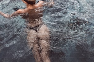 a person in the water with a frisbee